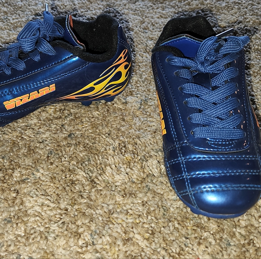 Toddler 8.5 soccer cleats and two pair of Adidas shin guards and pair of socks